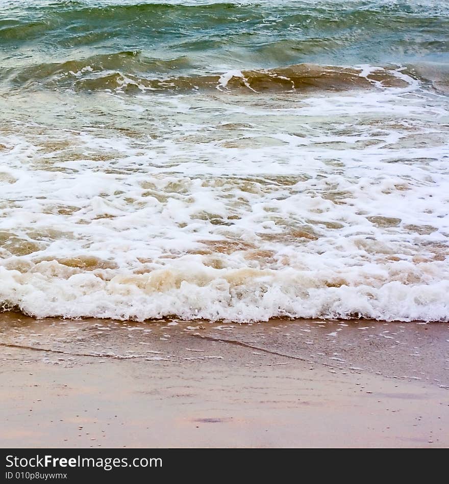 Sea wave and sand