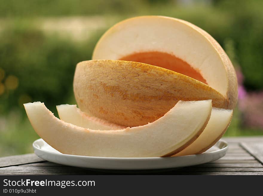 The ripe cut melon on a table