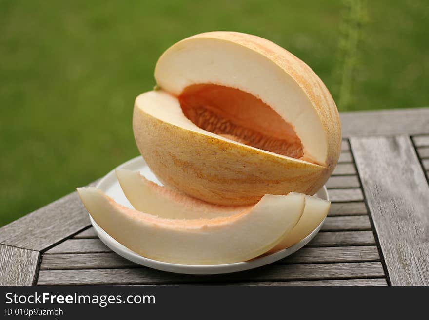 The ripe cut melon on a table