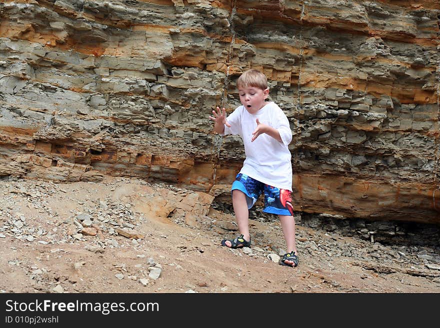 A young boy is excited and happily discovering and exploring sea creatures at the tidepools at the Pacific Ocean. A young boy is excited and happily discovering and exploring sea creatures at the tidepools at the Pacific Ocean.