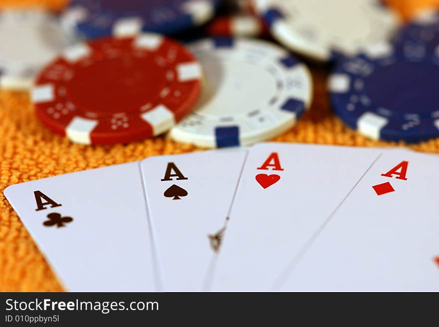 Cards and chips to play on a orange background. Cards and chips to play on a orange background.