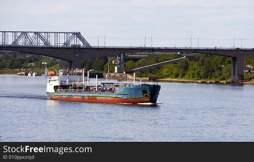 The barge with cargo on the river