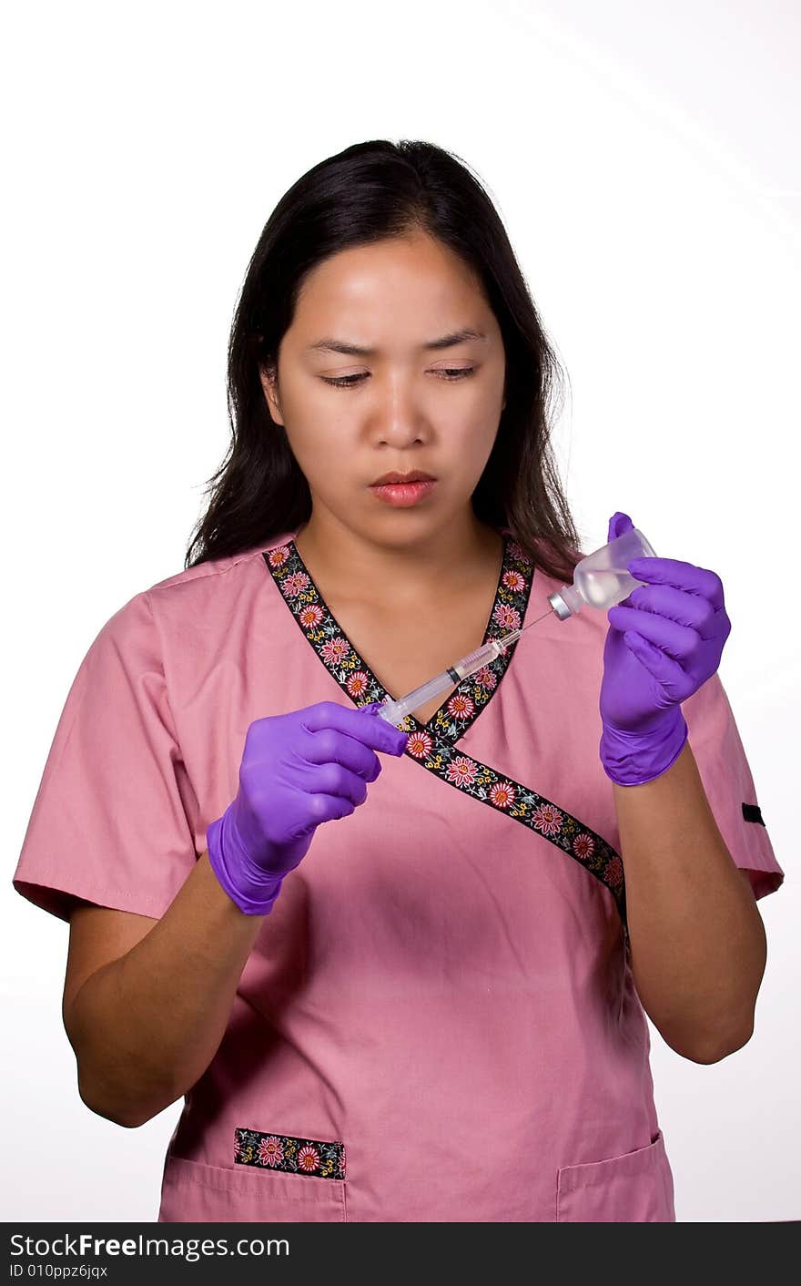 Medication Nurse drawing out a medication from the syringe.