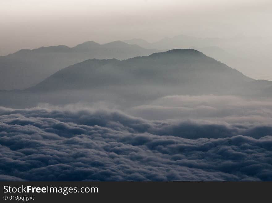 A photo taken from Mt Fuji showing mountains and clouds. A photo taken from Mt Fuji showing mountains and clouds.