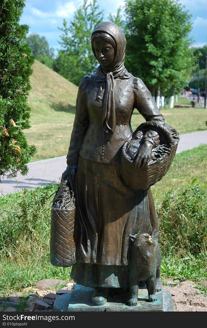 Sculpture of russian peasant woman with basket, Dmitrov town, Russia