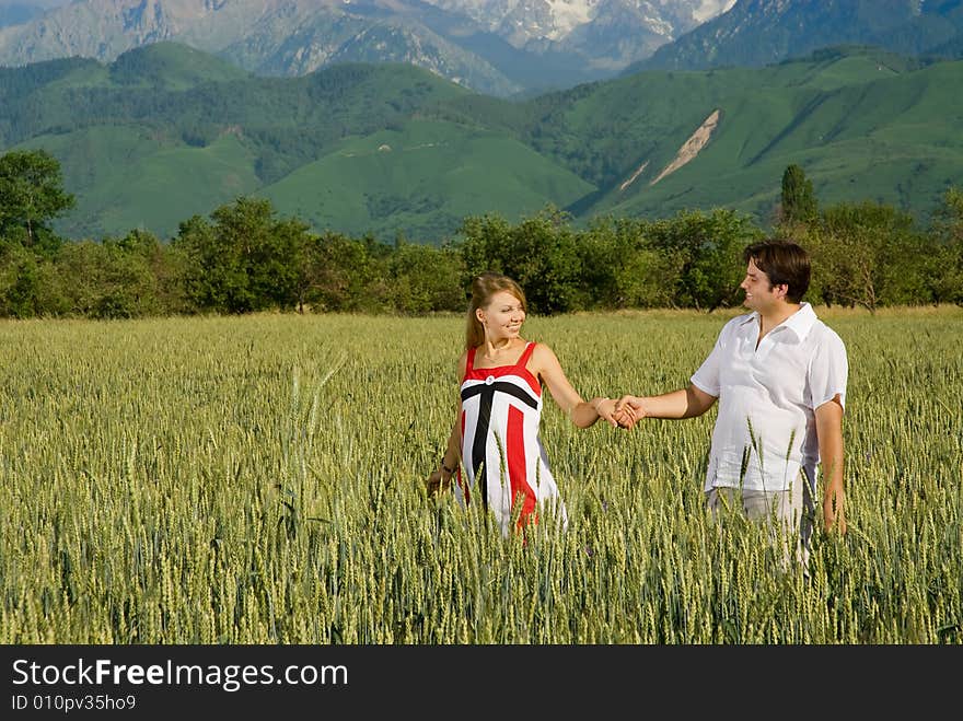 Young couple in a field of wheat. Young couple in a field of wheat