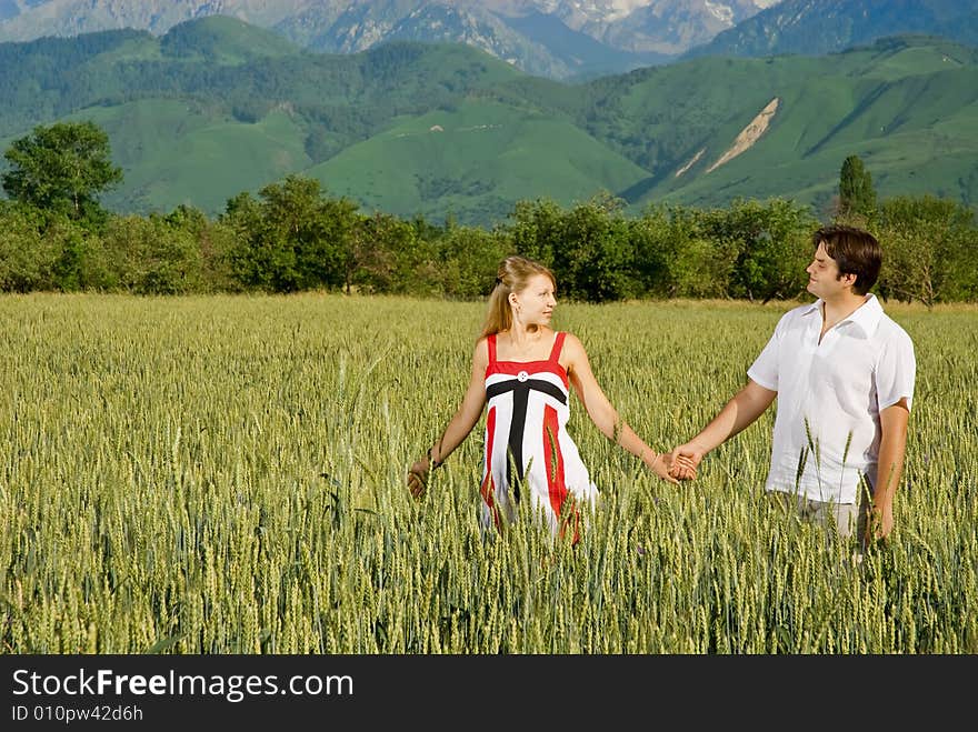 Young couple in a field of wheat. Young couple in a field of wheat