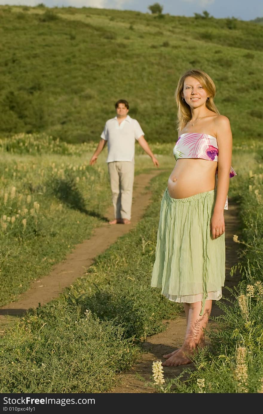 Young married couple on the walk, woman is pregnant. Young married couple on the walk, woman is pregnant