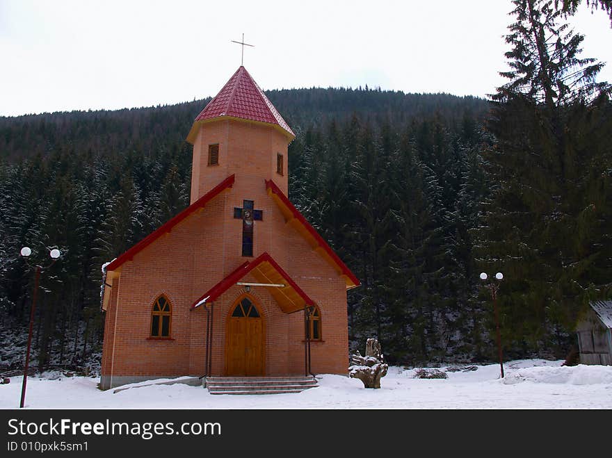 Small chapel in a snow covered wood. Small chapel in a snow covered wood