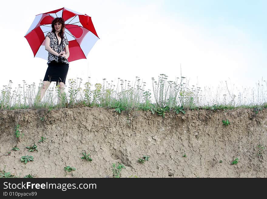 A beautiful girl and an umbrella. A beautiful girl and an umbrella