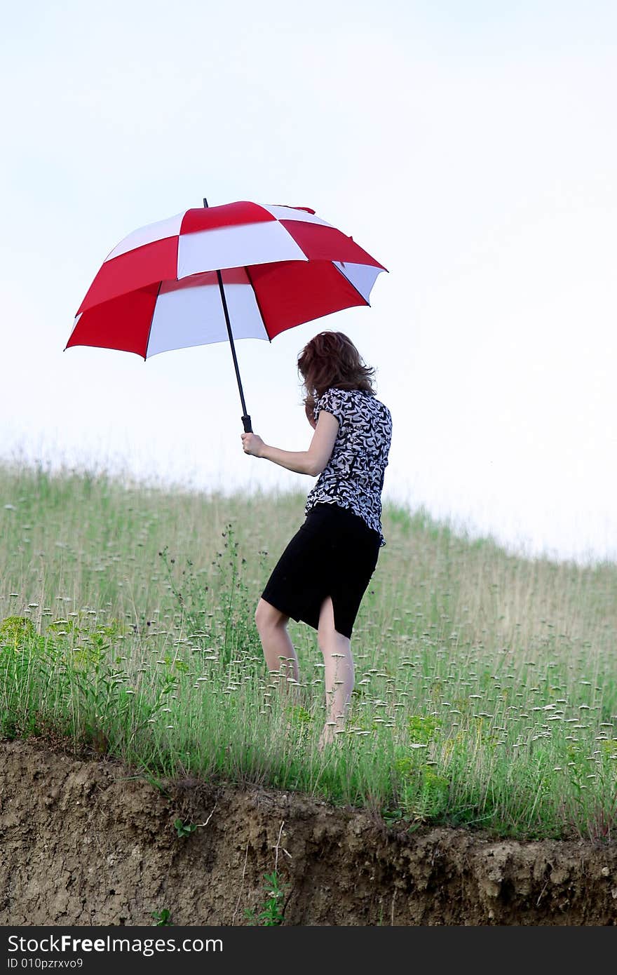 A beautiful girl and an umbrella. A beautiful girl and an umbrella