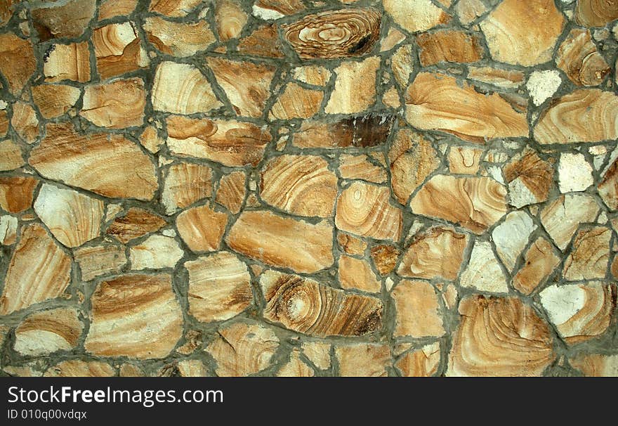 Structure of a wall reveted by a natural stone. Structure of a wall reveted by a natural stone