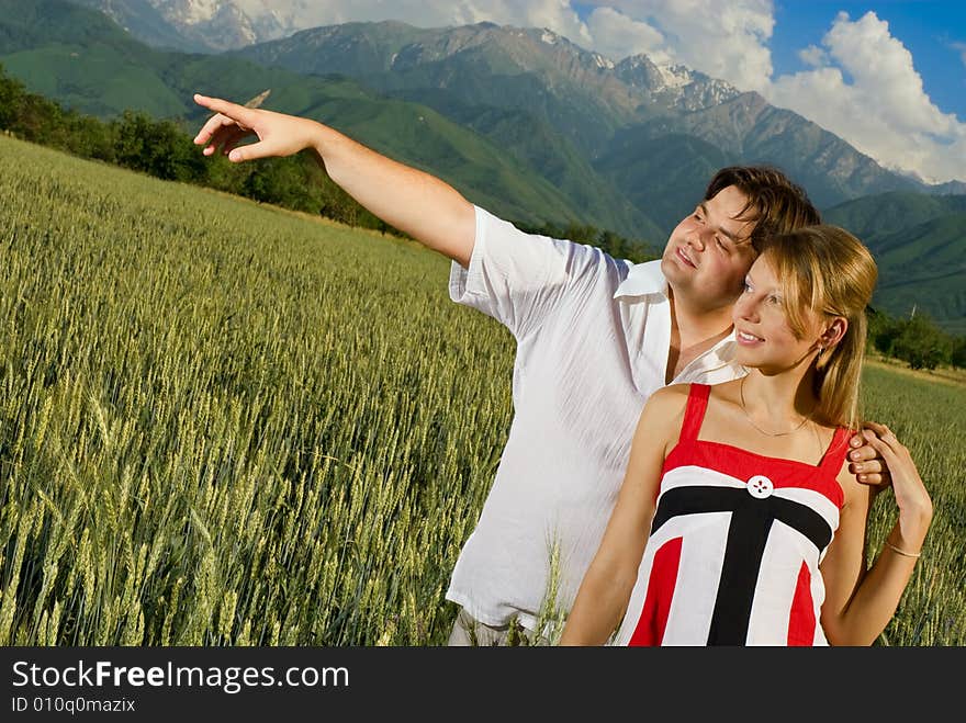 Young married couple in a wheat field. Young married couple in a wheat field