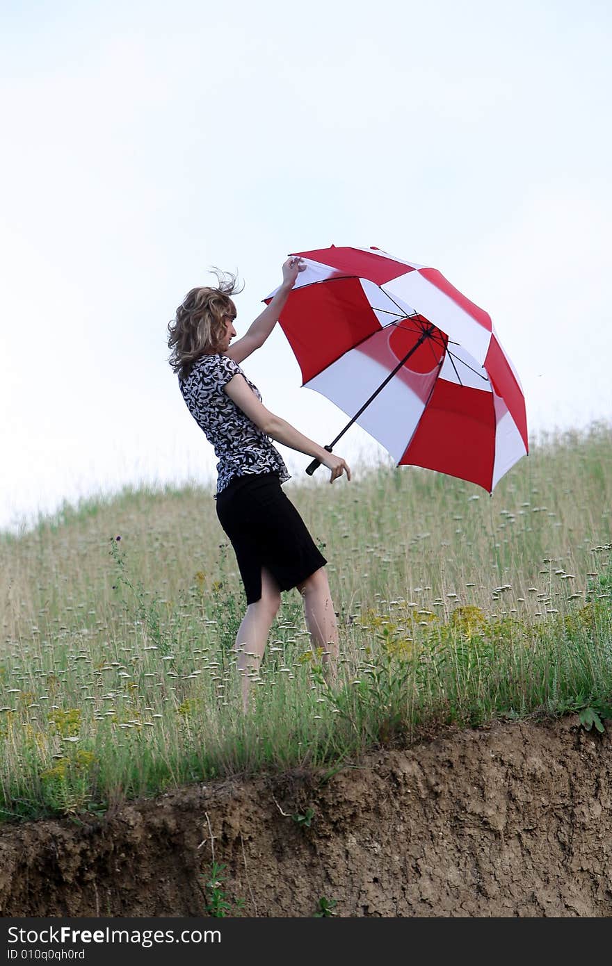 A beautiful girl and an umbrella. A beautiful girl and an umbrella