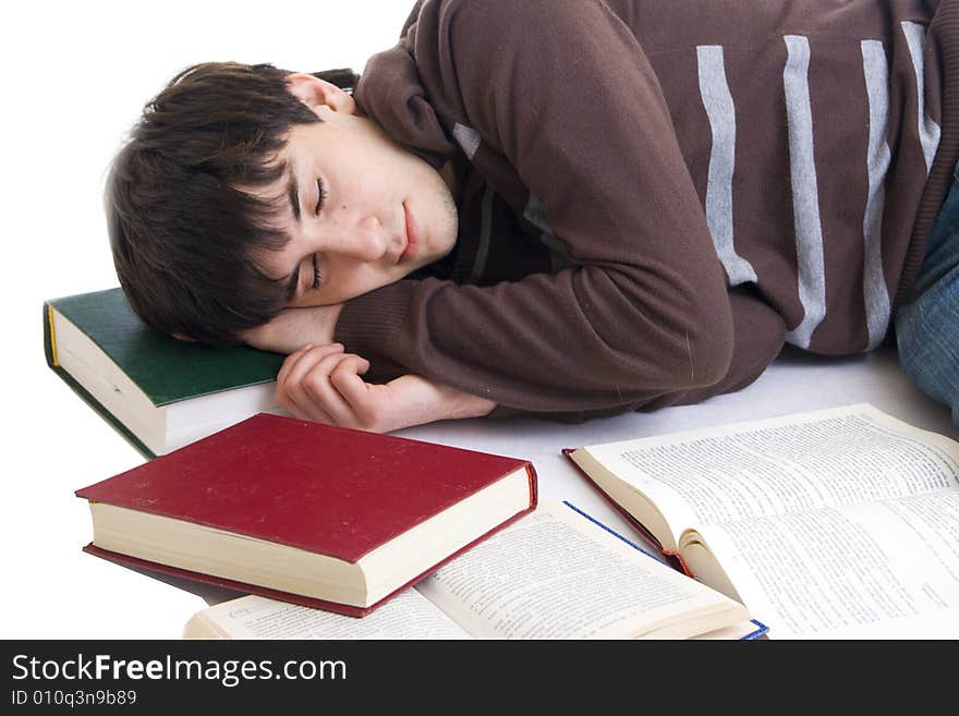 The sleeping student with the books isolated on a white background