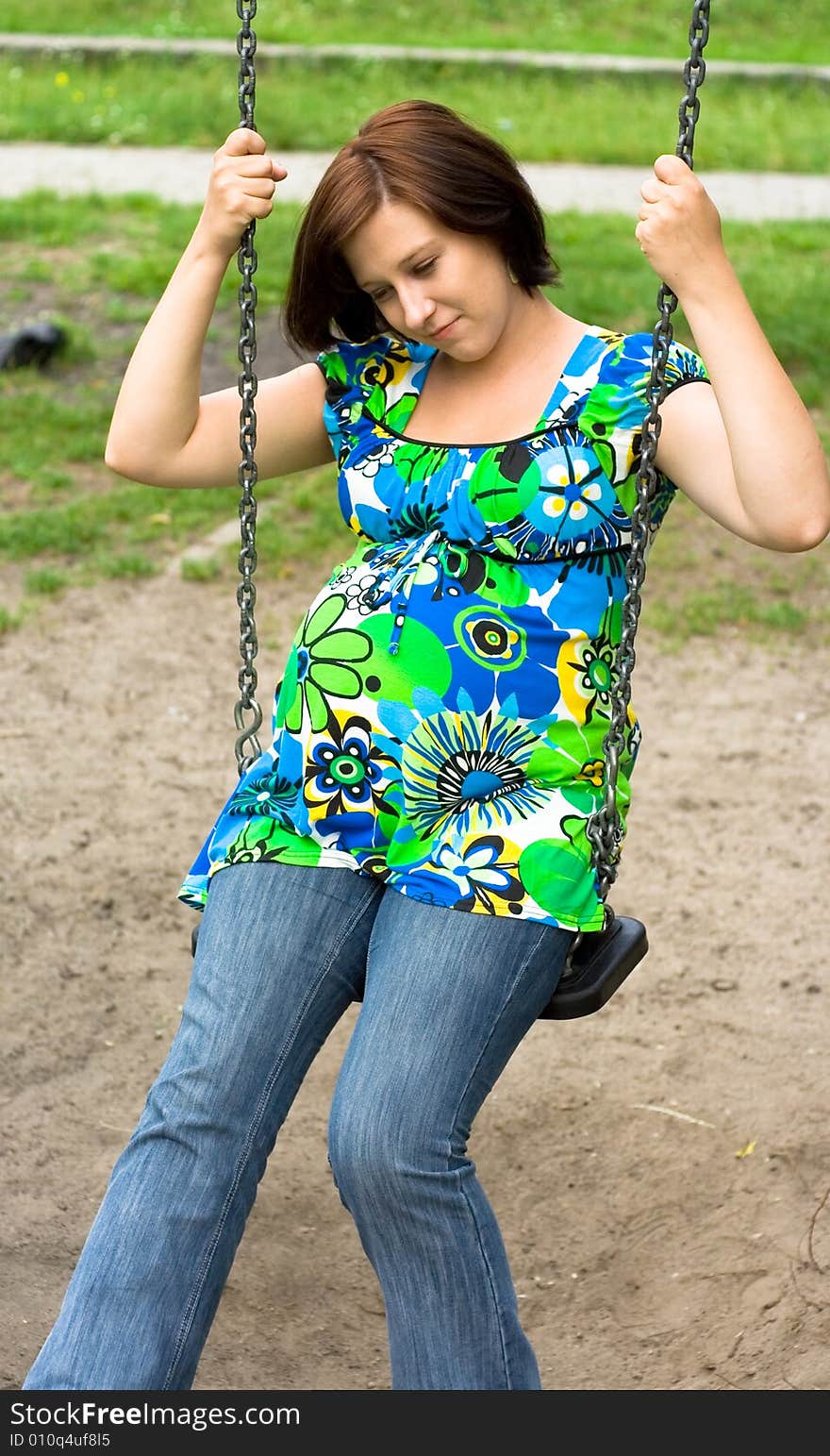 Pregnant woman on the playground. Pregnant woman on the playground