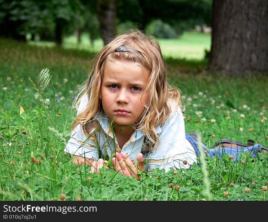 Child Lying In Grass