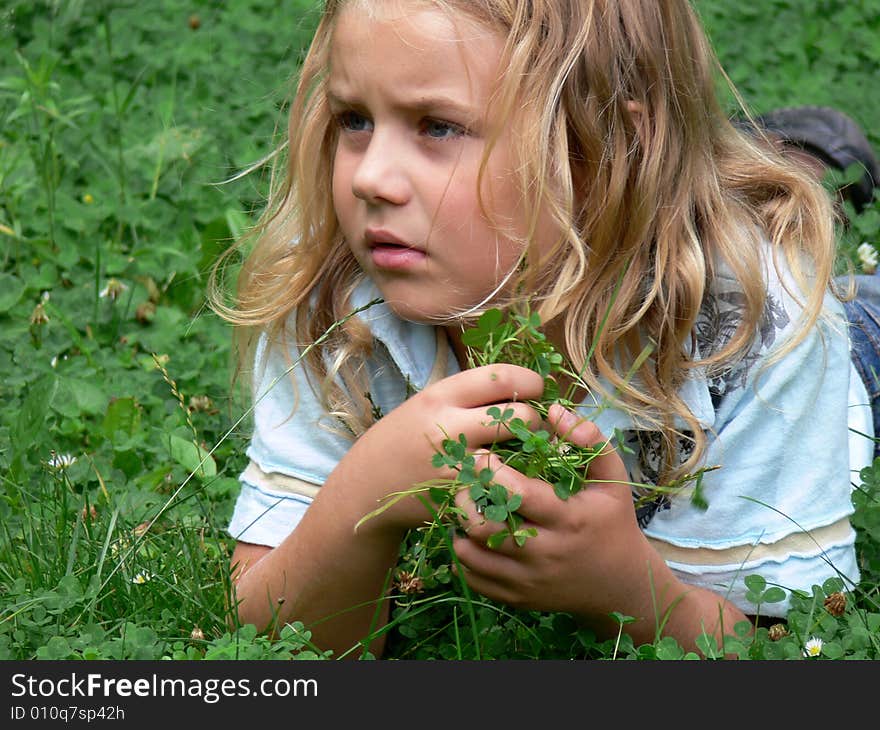 Child lying in grass