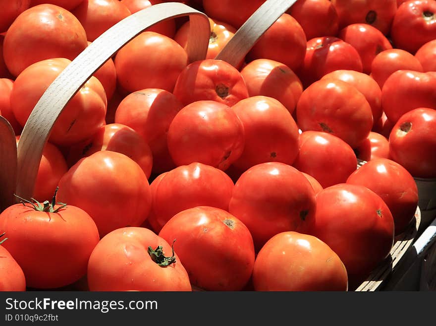 Tomatoes in baskets at the farm stand