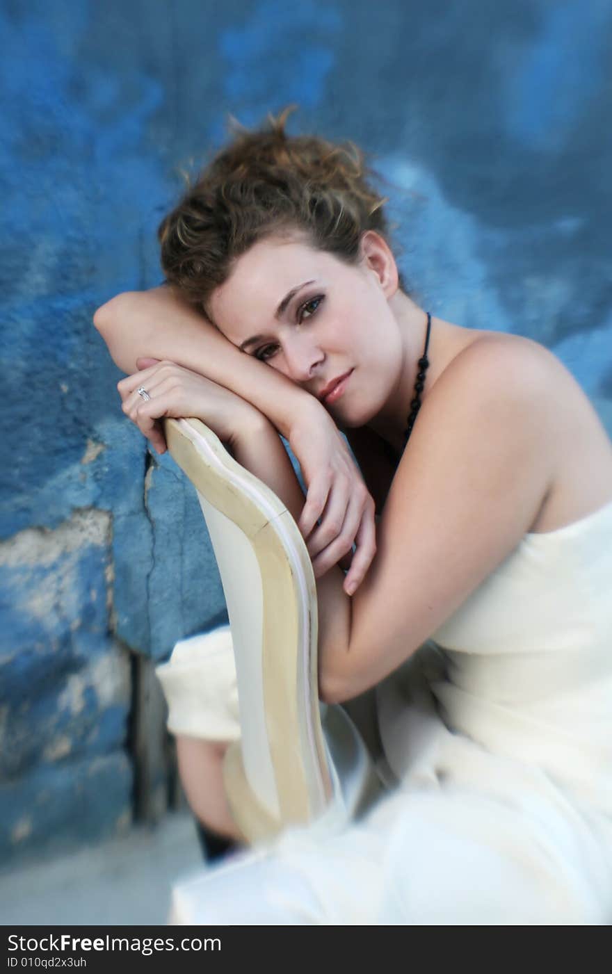 A soft image of a woman in a wedding gown in an urban setting. A soft image of a woman in a wedding gown in an urban setting