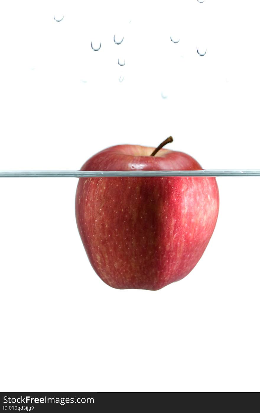 Apple in water. Photo on a white background.