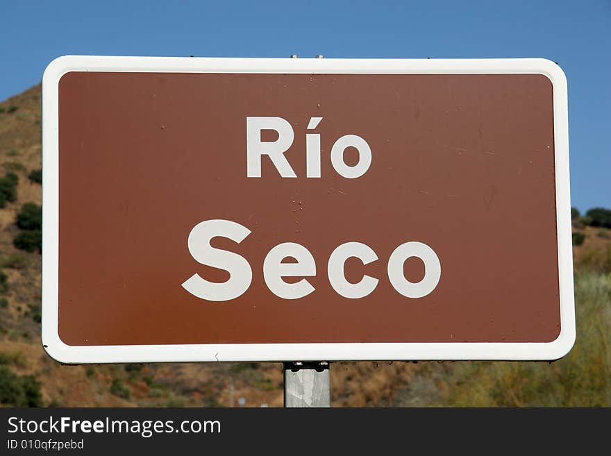 A sign of a river in southern Spain; ironically it's called 'dry river'. A sign of a river in southern Spain; ironically it's called 'dry river'