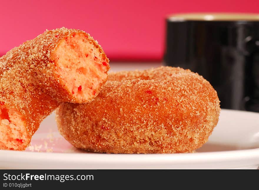 Doughnuts On A Plate With A Coffee Cup