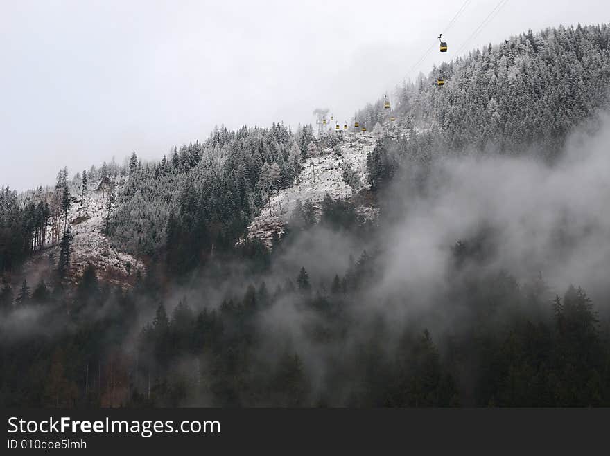 Cable road above the foggy forest in Alps (Austria). Cable road above the foggy forest in Alps (Austria)