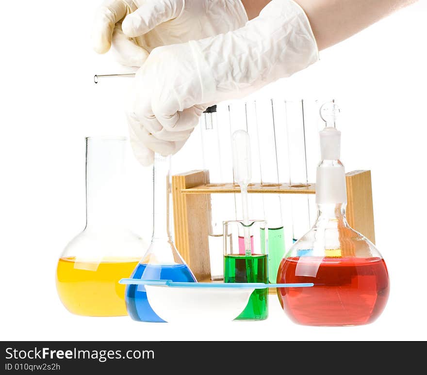 Various colorful glass laboratory ware on a white background. Various colorful glass laboratory ware on a white background