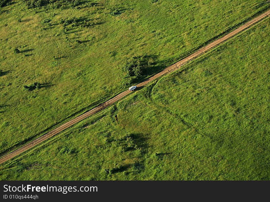 Van Travelling Across The Masai Mara