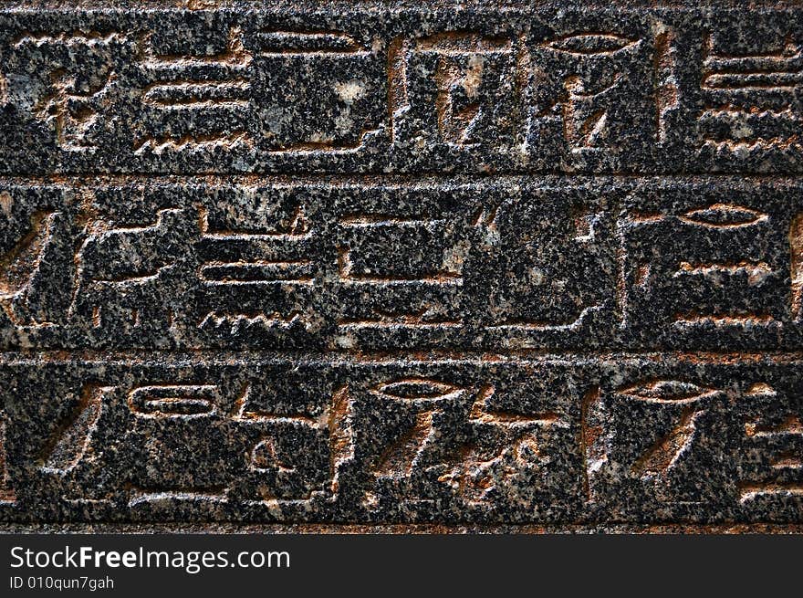 Ancient egyptian hieroglyphs engraved in stone