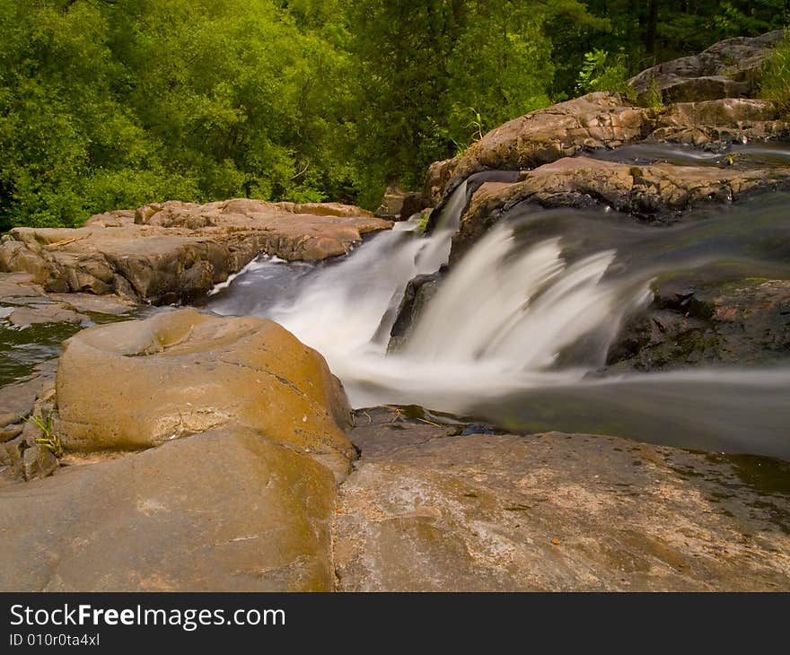 Rapids Falling Into the Forest