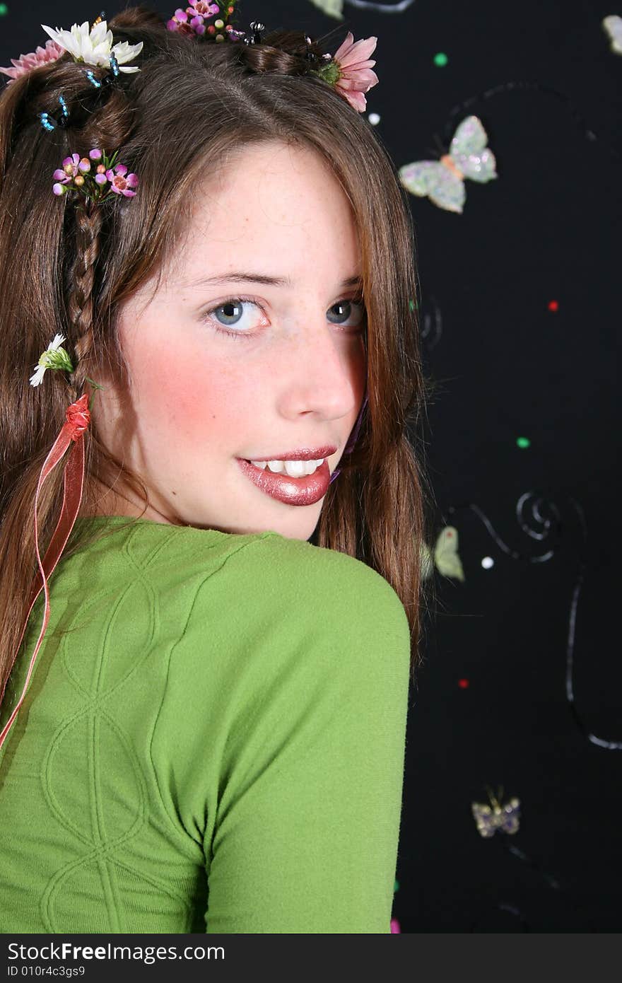 Teenage model with flowers and butterflies in her hair. Teenage model with flowers and butterflies in her hair