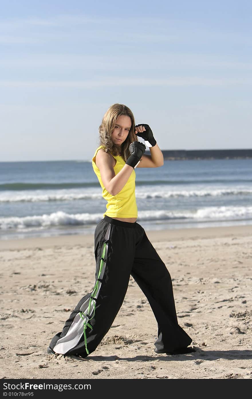 Girl fighting in a the beach