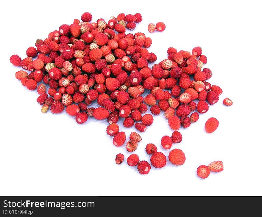 Ripe wild strawberry on a light cloth