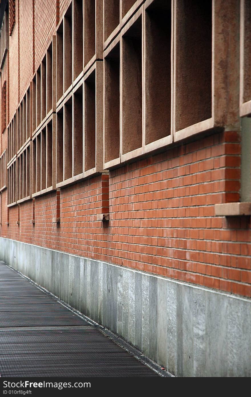 Morern architecture in Milan. Perspective and parallel lines and squares, red bricks. Morern architecture in Milan. Perspective and parallel lines and squares, red bricks.