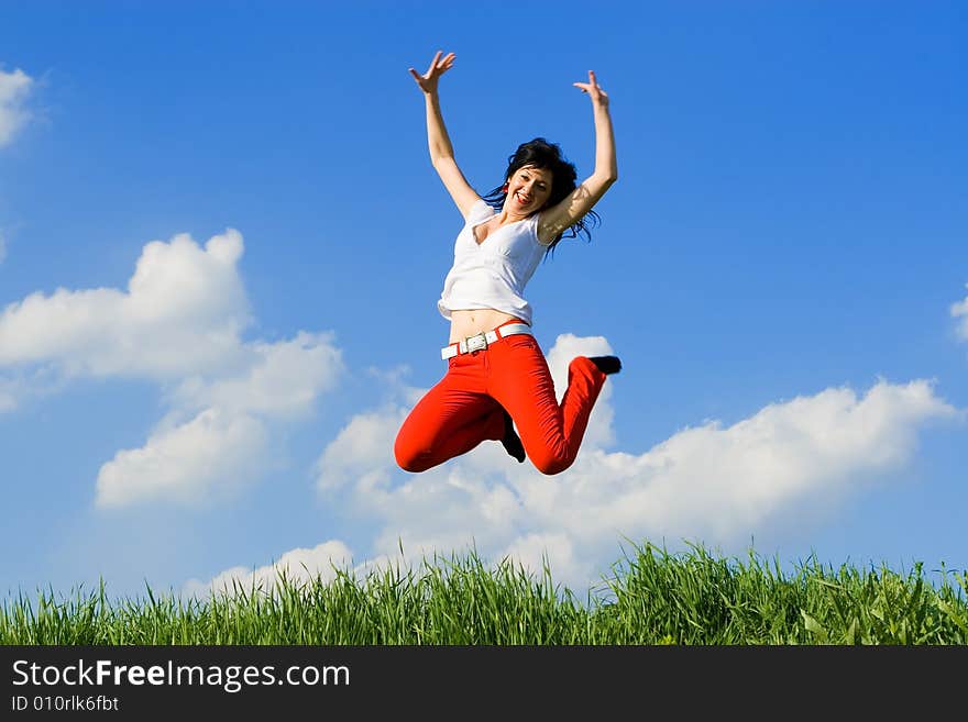 Pretty young woman is jumping