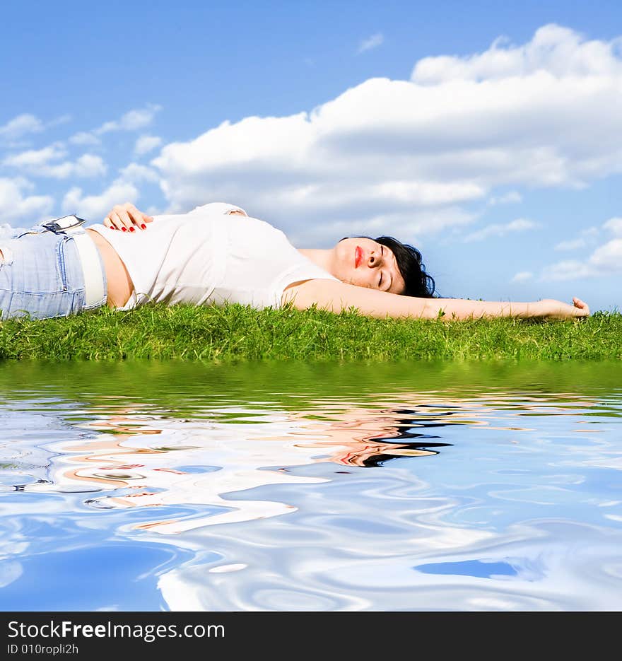 Woman rest on the green grass