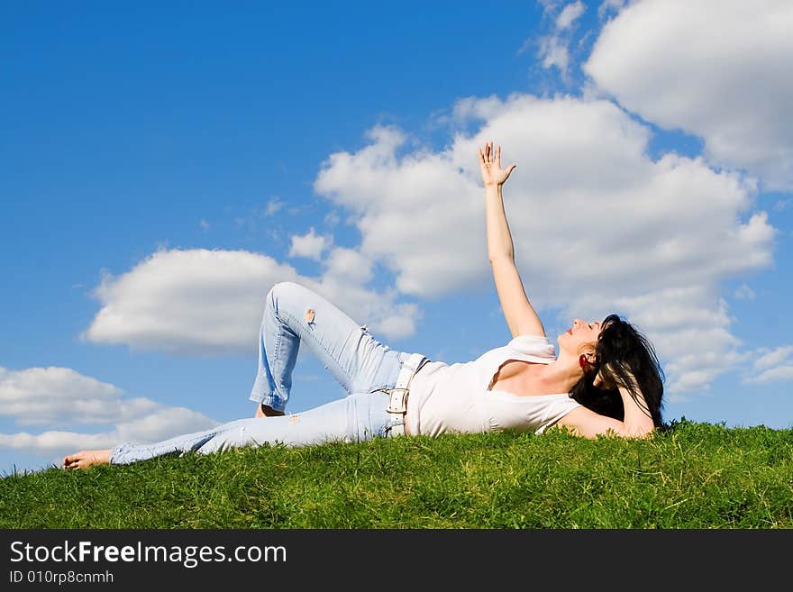 Woman rest on the green grass