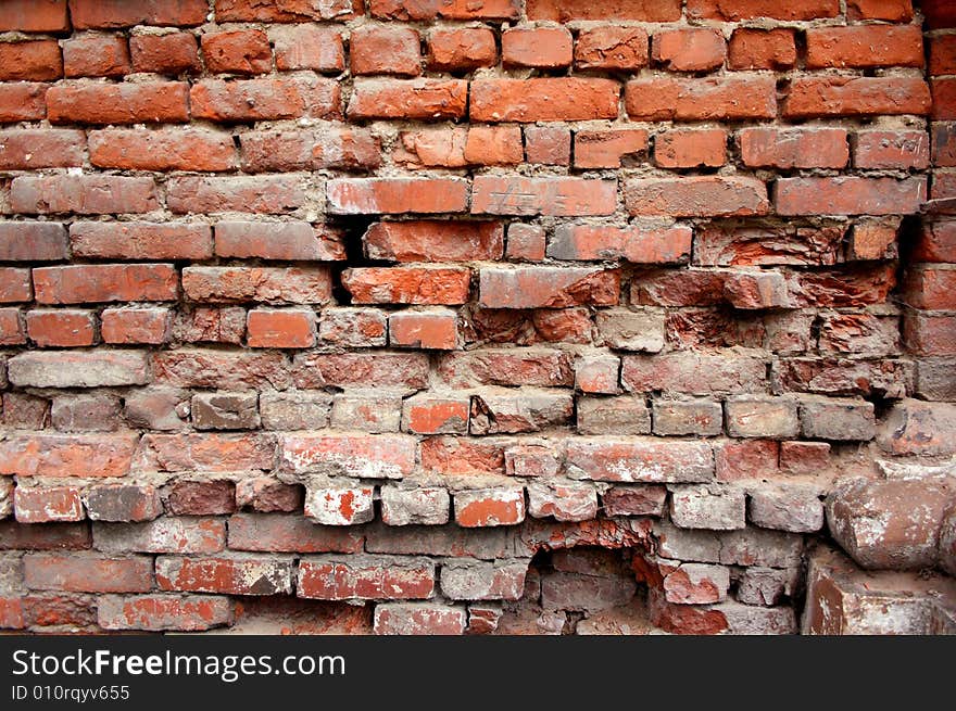 The old broken wall from a red flat brick. The old broken wall from a red flat brick.