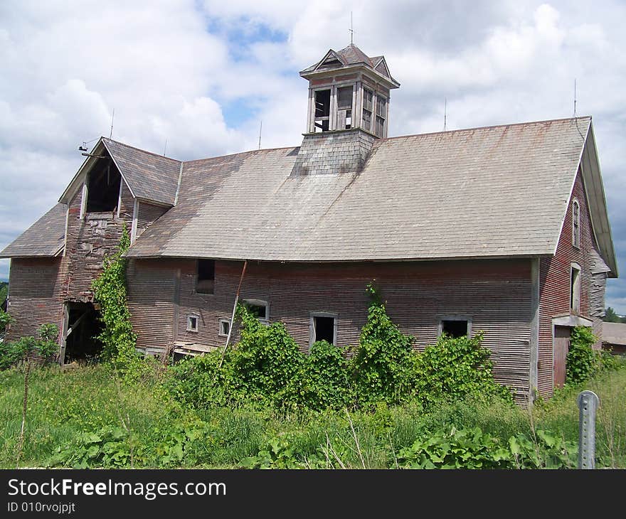 A beautiful old barn still being partially used.