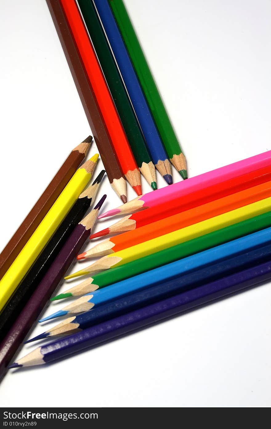 Pencils of red, green, blue, yellow, orange color on a light background. Pencils of red, green, blue, yellow, orange color on a light background.