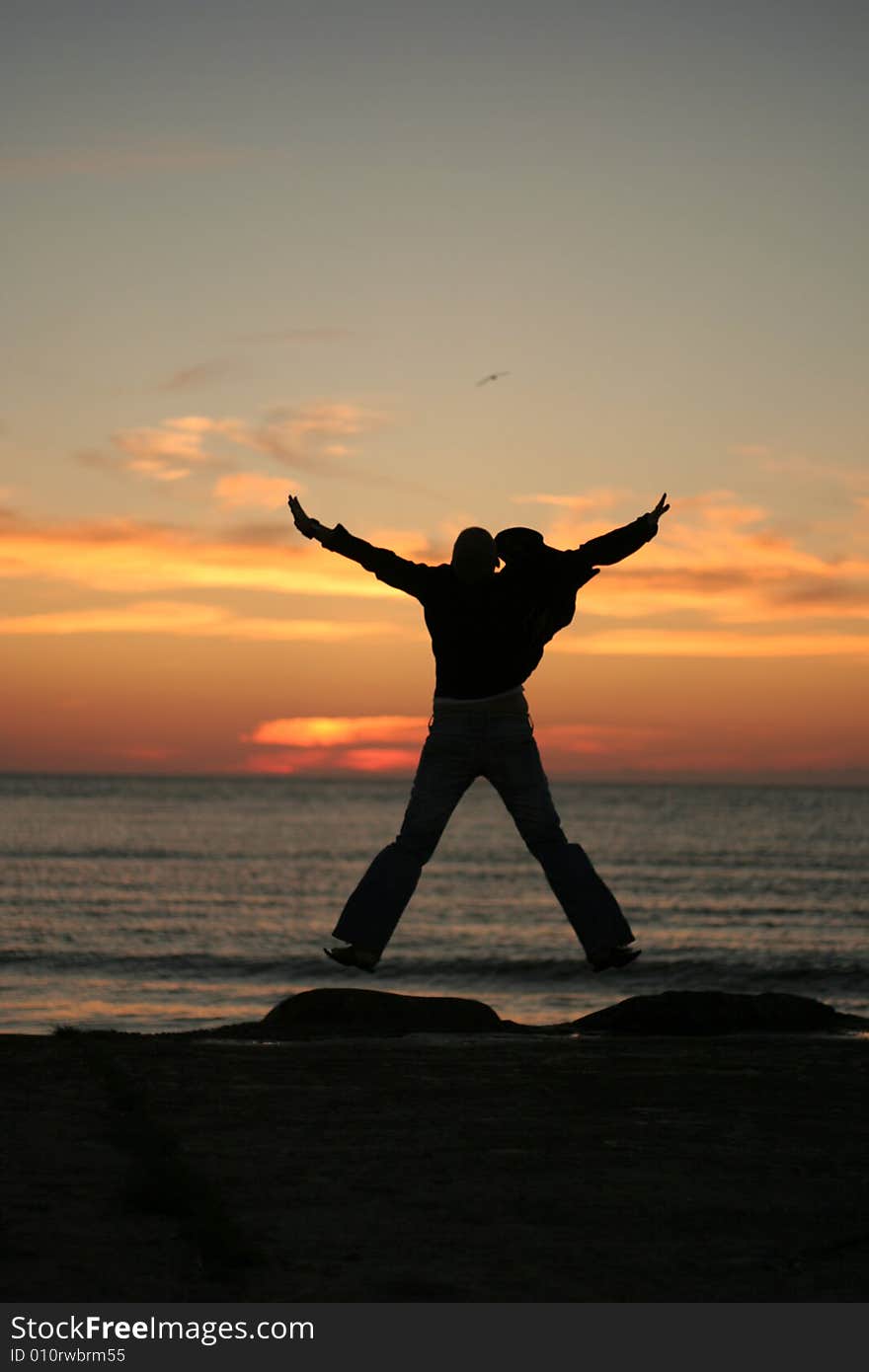 Silhouette of the girl on a background of a decline