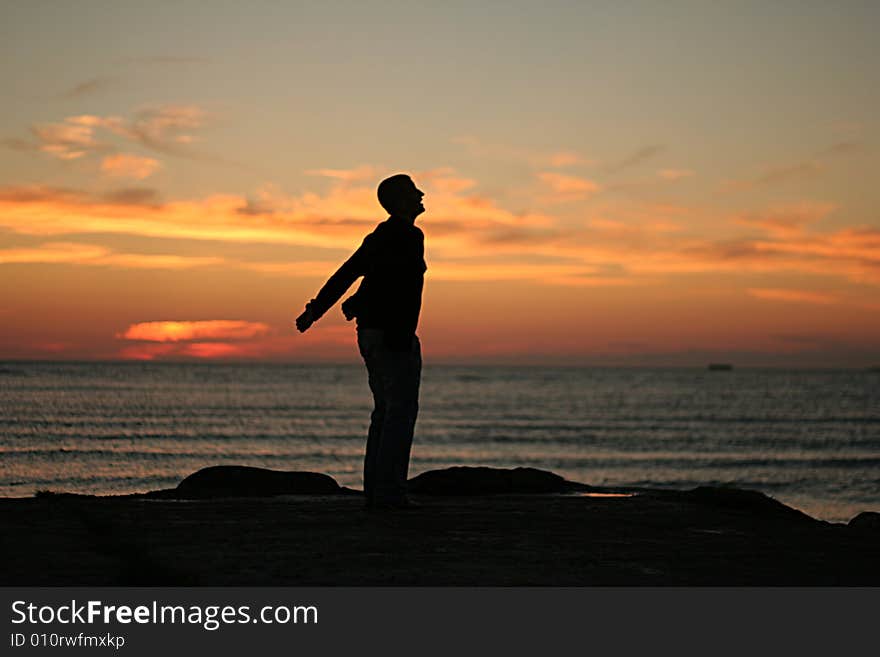 Silhouette of the girl on a background of a decline