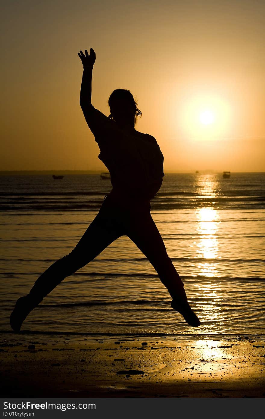 A silhouette of a girl jumping. A silhouette of a girl jumping.