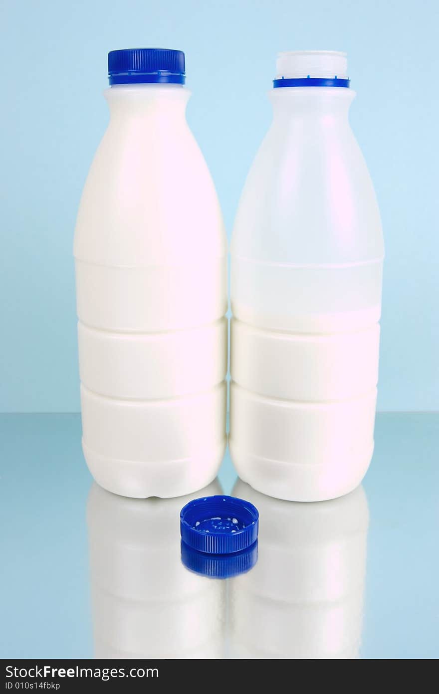 Full cream milk isolated against a blue background