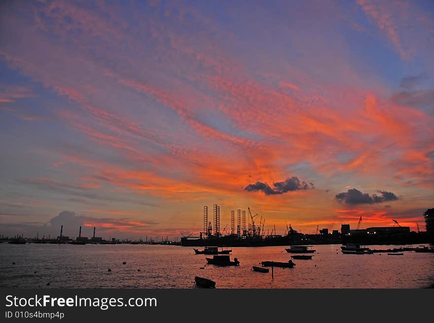 Sunset, cloud and boat at the seaside