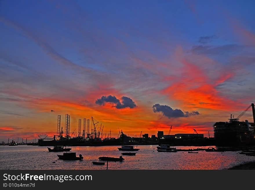 Sunset, cloud and boat at the seaside