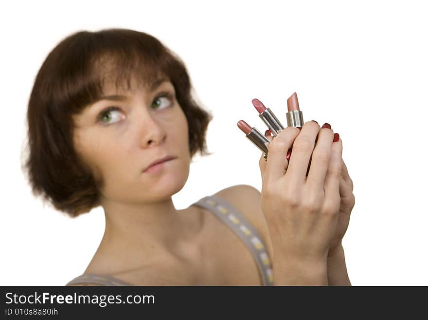 Woman choosing a lipstick