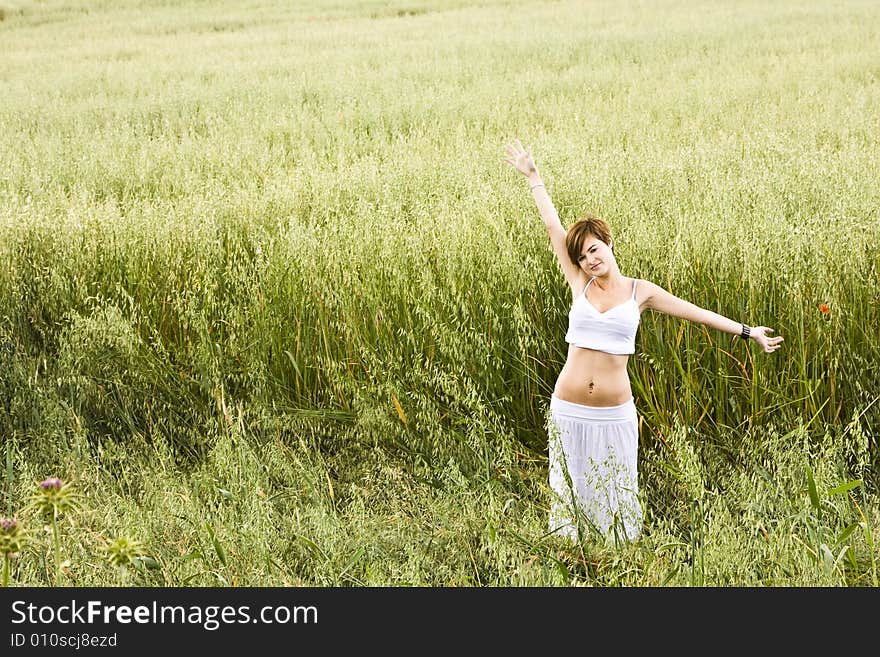 Woman feeling freedom in a field. Woman feeling freedom in a field.